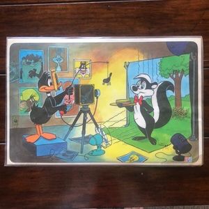 Vintage Warner Bros Pepe Le Pew and Daffy Duck 1976 Laminated Placemat.
